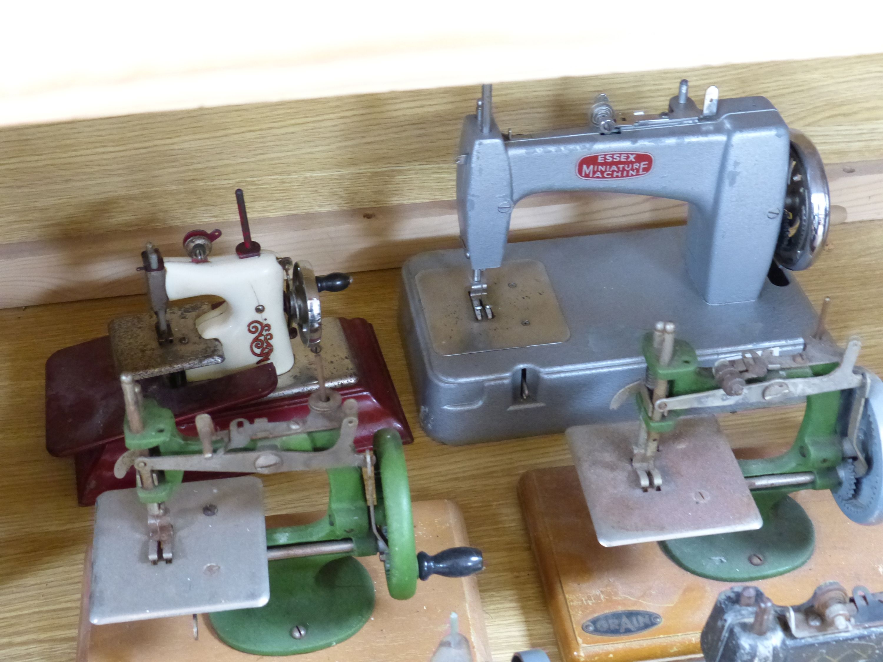 Six miniature sewing machines